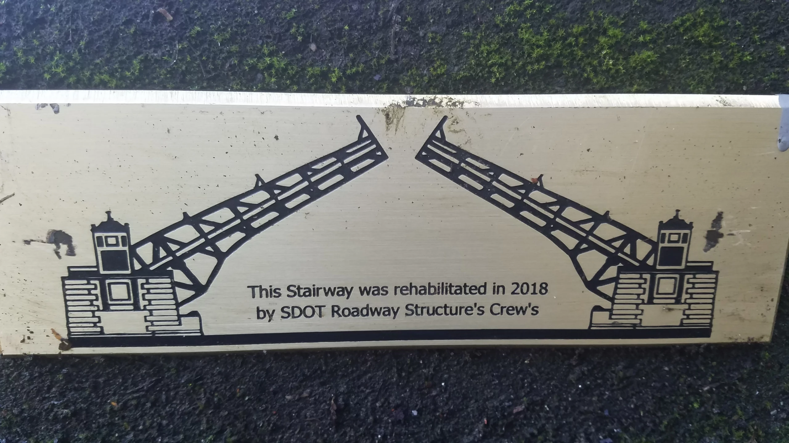 A picture of a draw bridge with the words: "The Stairway was rehabilitated in 2018 by SDOT Roadway Structure's Crew's