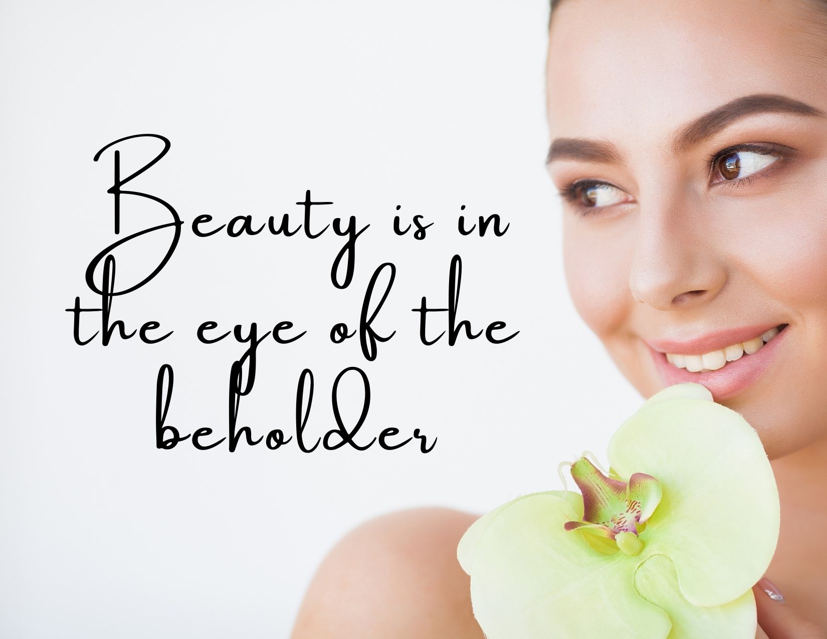 A graphic of a beautiful woman with the phrase "beauty is in the eye of the beholder"