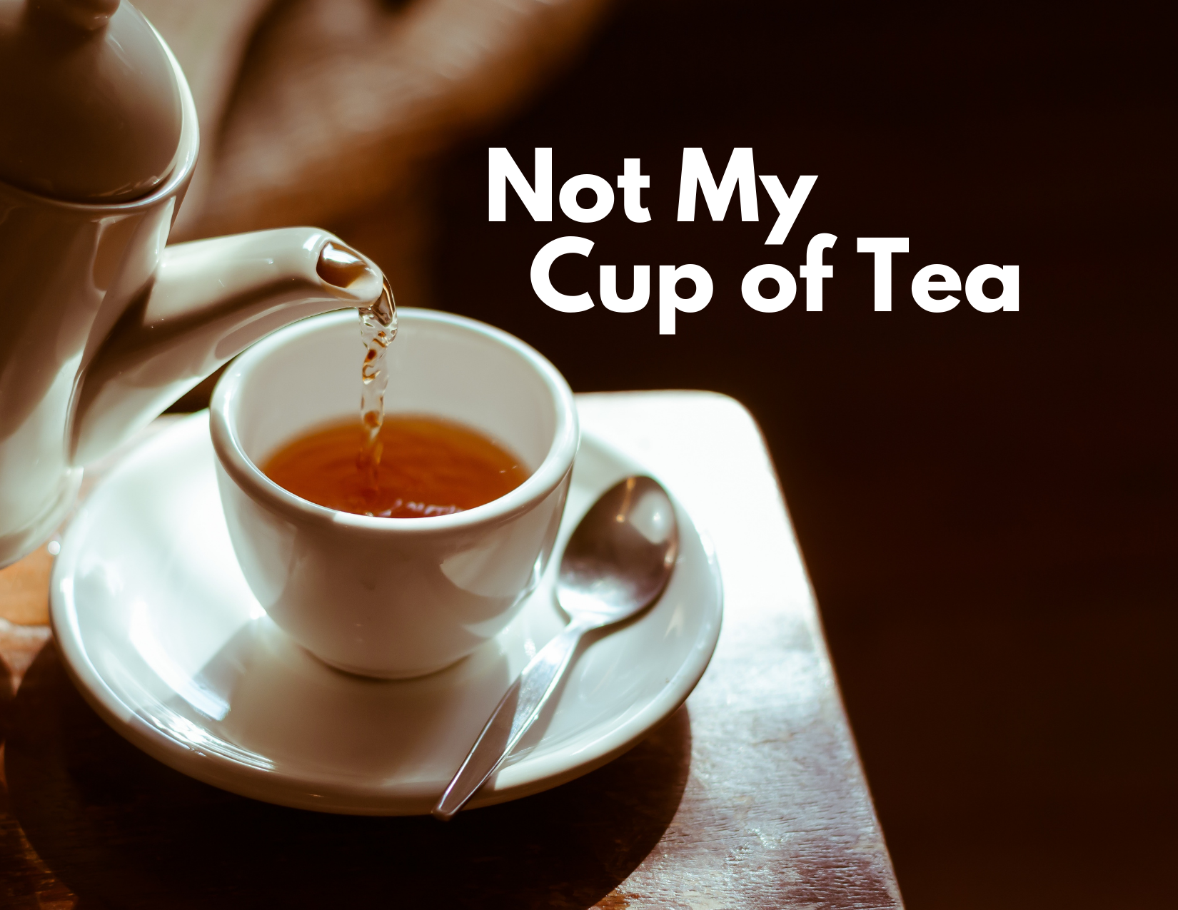A picture of tea being poured into a cup with the caption - Not My Cup Of Tea