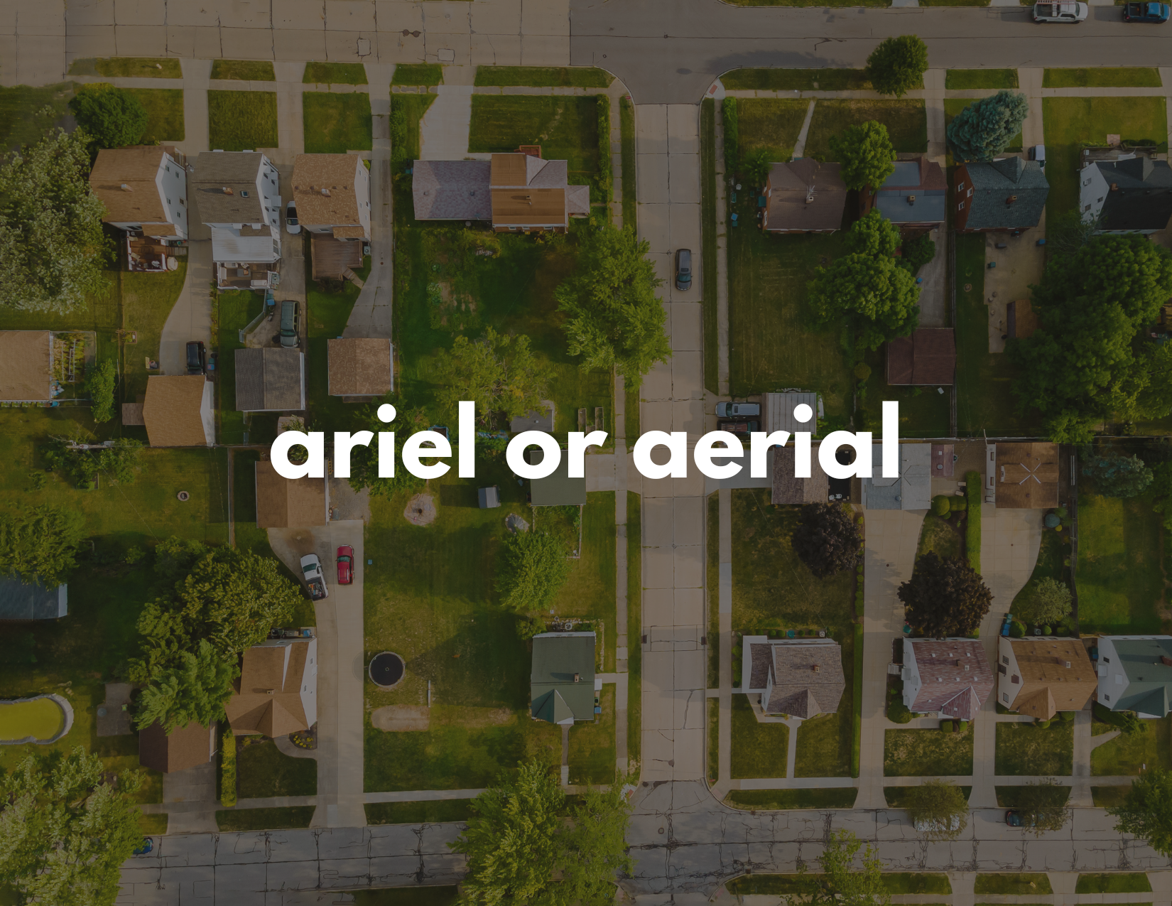 An aerial view of a suburban town with the words ariel or aerial