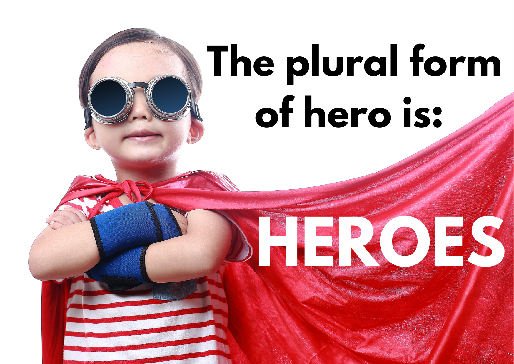 A boy dressed as a superhero with the words: the plural form of hero is HEROES